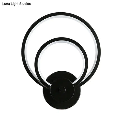 Modern black circular led light fixture with two concentric rings and remote control for bedroom wall sconce use