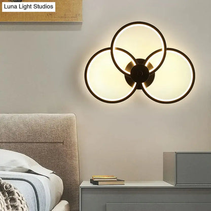 Modern black circular led light fixture wall sconce with three interlocking glass panels and remote control feature