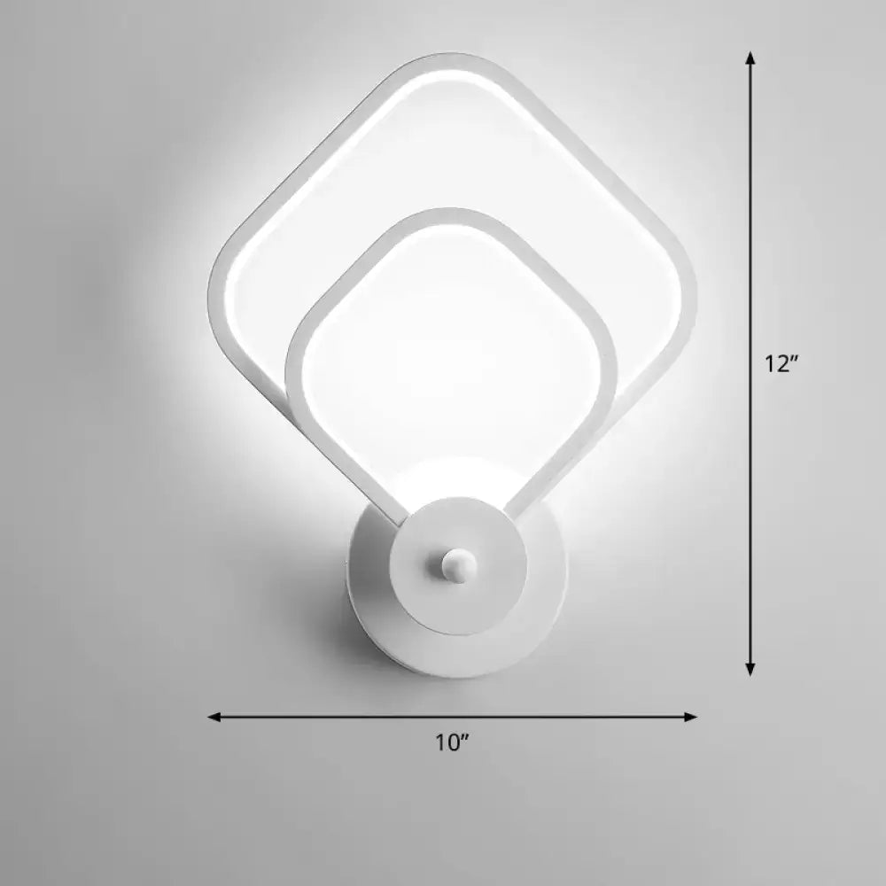 Modern white led wall sconce with two overlapping square panels as a remote control light fixture for bedroom walls