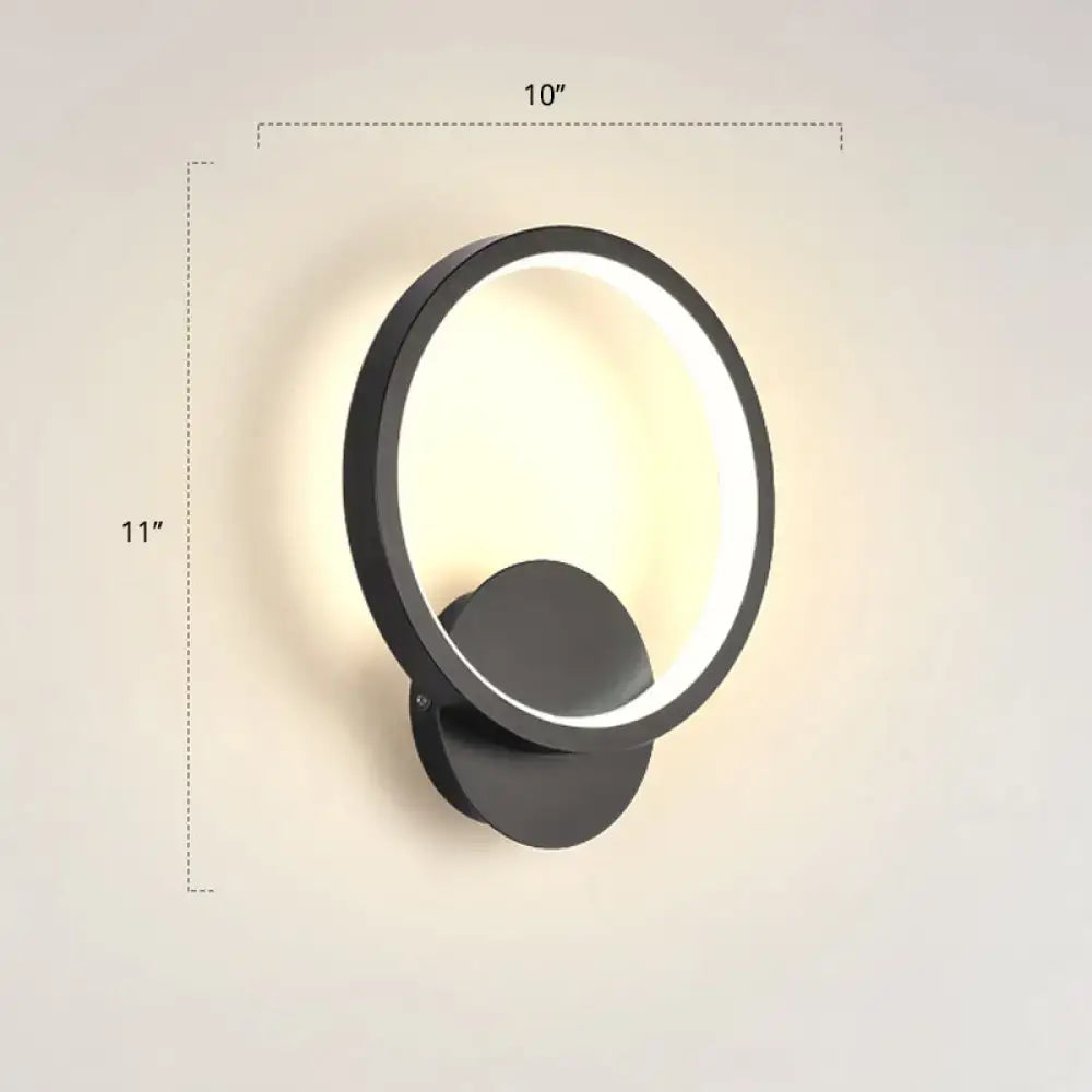 Modern black circular led wall sconce light fixture with glowing ring and minimalist design inches high for bedroom use