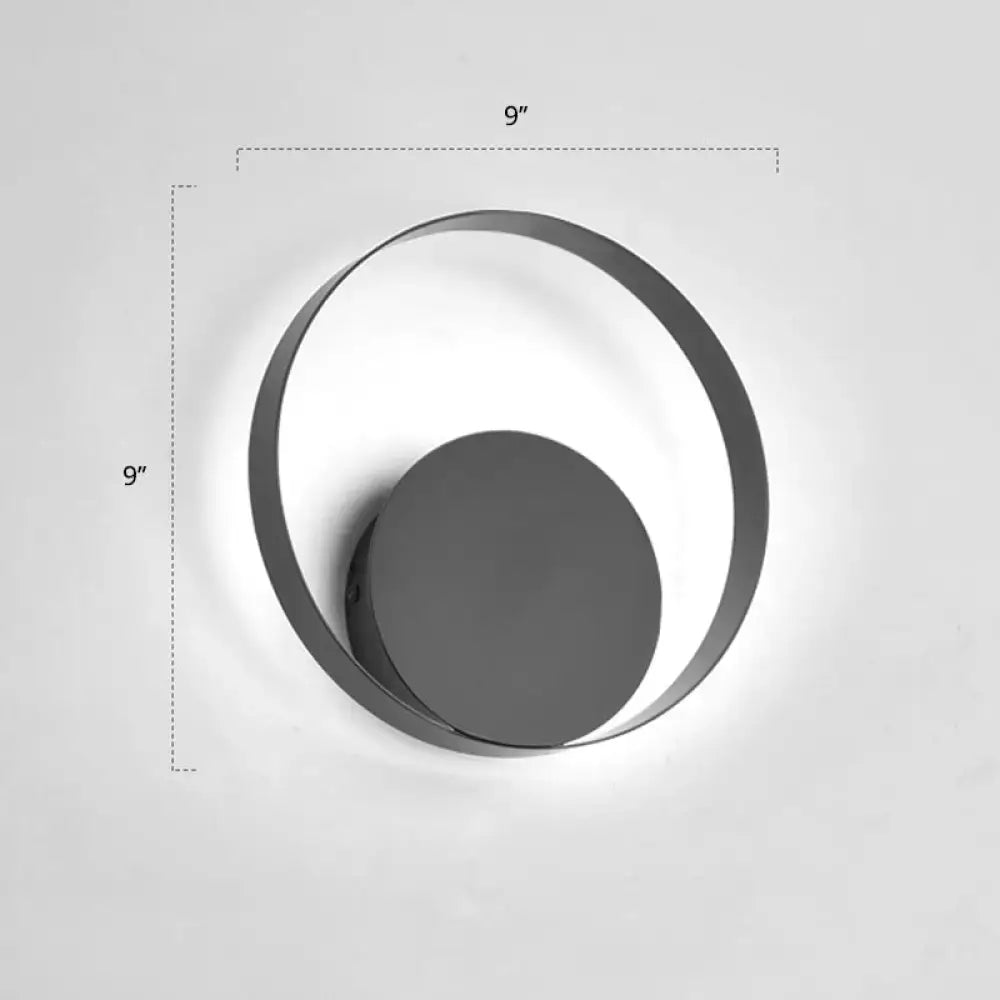Modern black circular led wall sconce light fixture with sleek minimalist frame and concentric ring design inches high