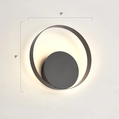 Modern black circular led wall sconce light fixture with sleek minimalist design and 9 inches high diameter