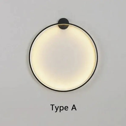 Minimalist modern black circular wall lamp with sleek frame and warm diffused LED lighting for living room decorbites circular wall