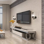 Modern black clear crystal drum wall lamp mounted above a white and silver media console with lg flat-screen tv