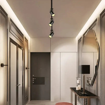 Black adjustable spotlights on a ceiling track featuring decorbites colorful rgb led for ktv stage decoration