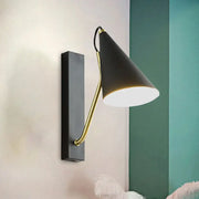 Modern black cone shade wall sconce with brass articulated arm ideal for bedroom led and incandescent lighting