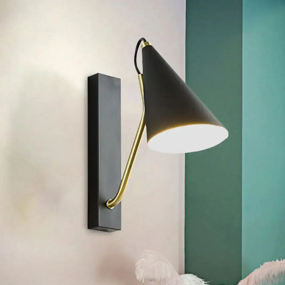 Modern black cone shade wall sconce with brass articulated arm ideal for bedroom led and incandescent lighting
