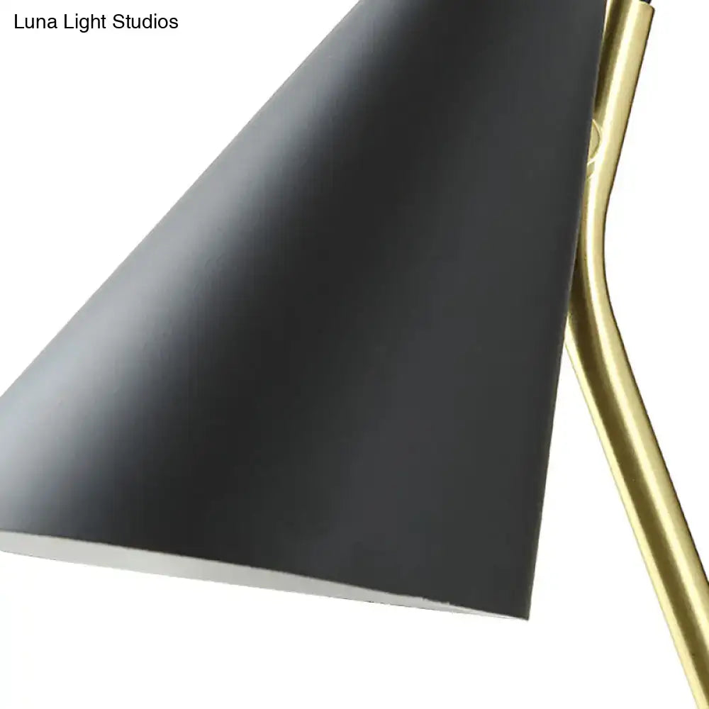 Modern black cone shade wall sconce with black matte finish and brass arm suitable for led incandescent fluorescent bulbs