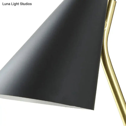 Modern black cone shade wall sconce with black matte finish and brass arm suitable for led incandescent fluorescent bulbs