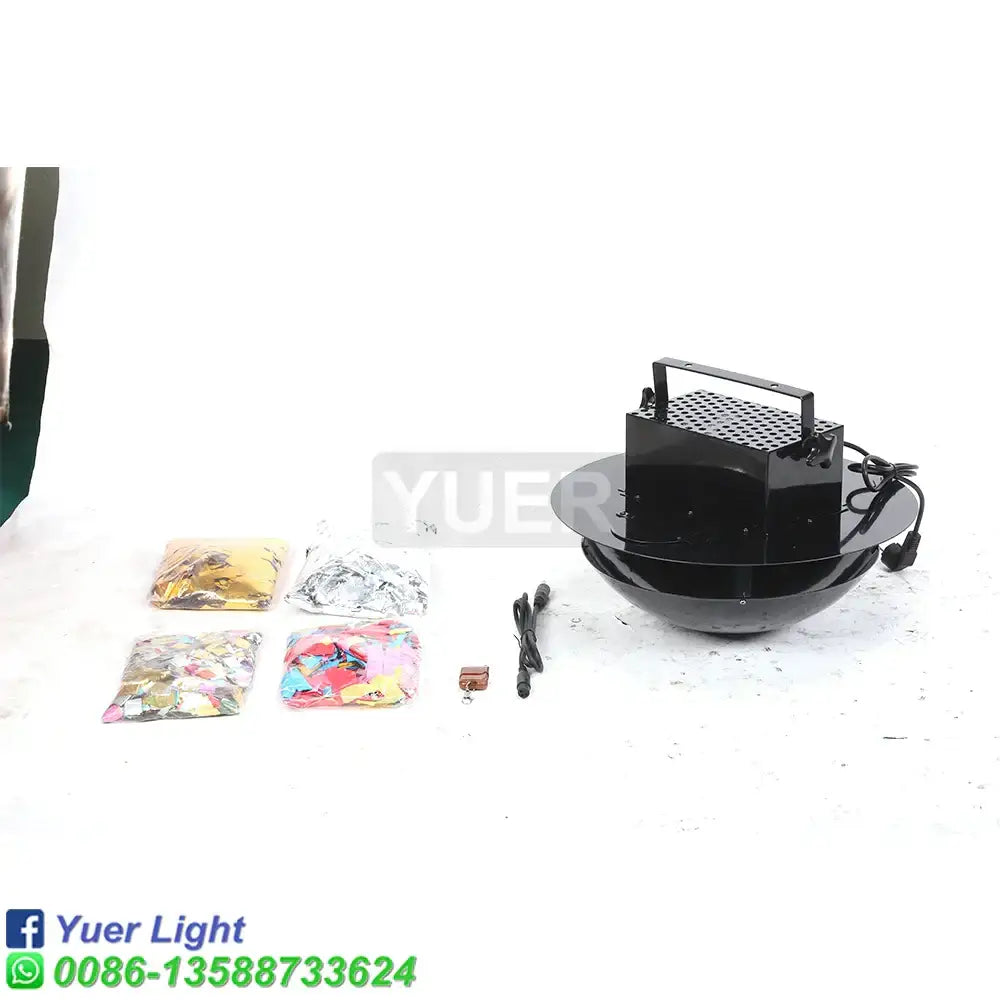 Modern black plastic confetti streamer cannon machine with perforated top and handle, featuring decorbites confetti and accessories