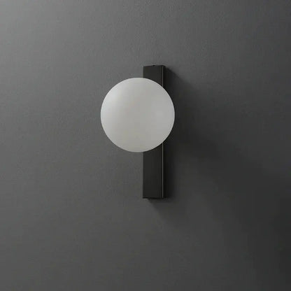 Modern black copper led wall sconce with matte black base and frosted white globe for bedroom lighting