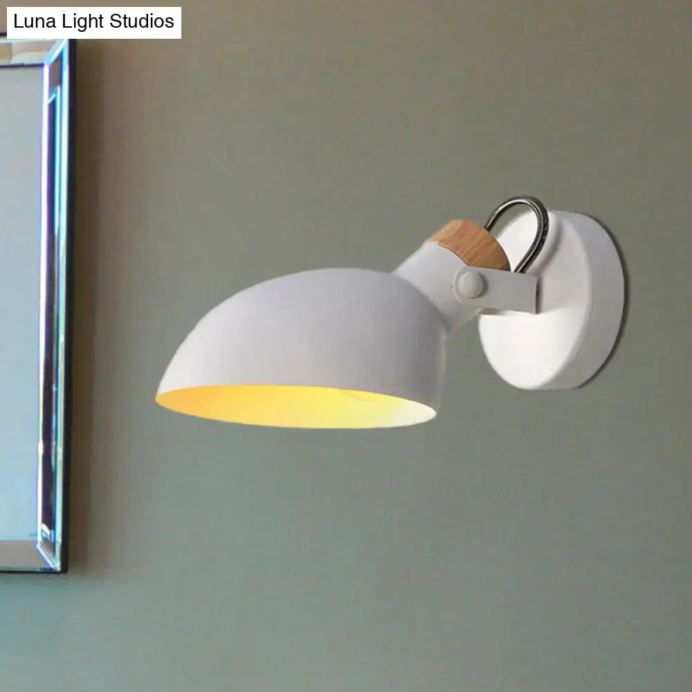 Modern black and cream adjustable wall sconce light with white matte metal and wooden accent for bedroom use