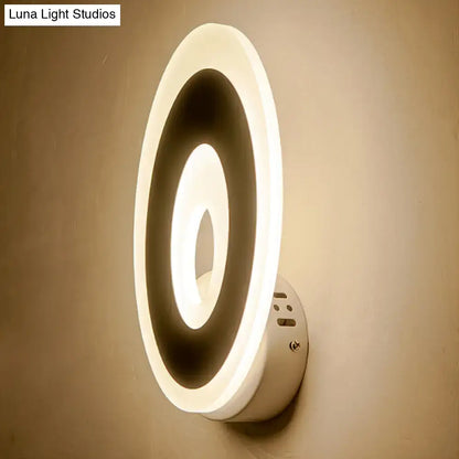 Modern white circular direct wired electric wall lamp with glowing ring design for bedroom light type use