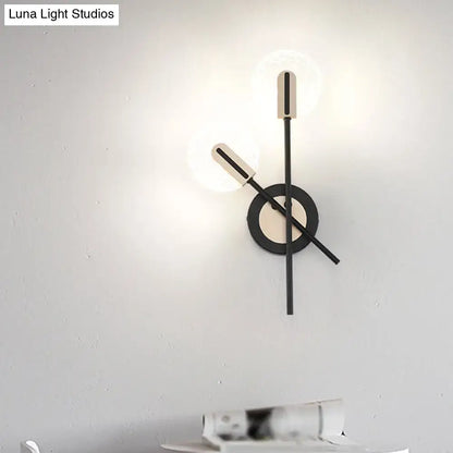 Minimalist wall-mounted clock with sleek black and white geometric design combined with modern black and cream warm white wall light sconce 220v-240v