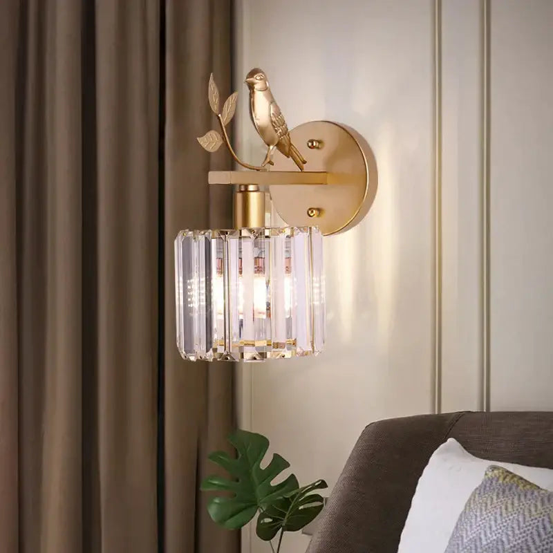 Modern black crystal bird wall lamp with gold-toned bird design and crystal cylinder shade for elegant decorbites crystal bird decor