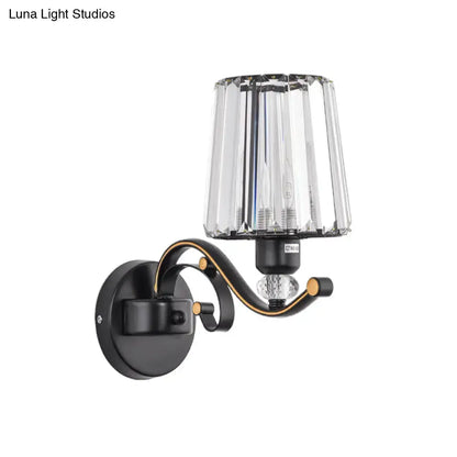 Modern black and gold wall light with faceted crystal design for living room elegance and ambient lighting