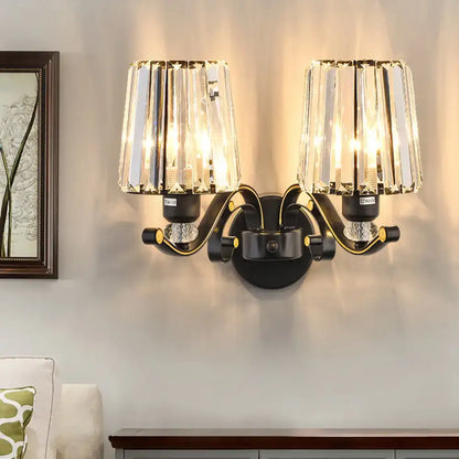 Modern black and gold two-light wall light with crystal glass shades for living room with crystal design