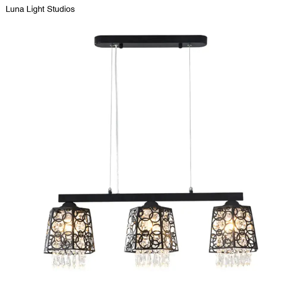 Modern black crystal droplet chandelier light fixture with three ornate crystal-encrusted shade shapes and dangling crystals