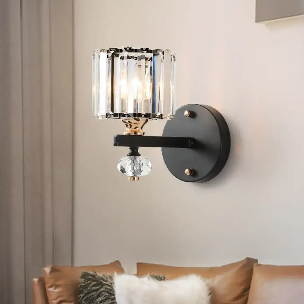 Modern black crystal drum wall sconce with a flush mount design featuring a crystal cylinder shade and faceted orb wall light
