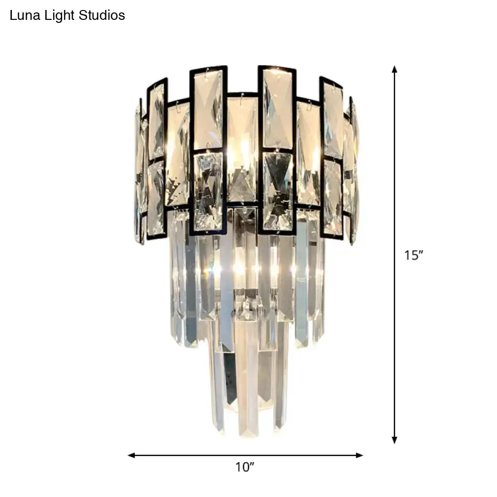 Modern black wall sconce with crystal embedded cascading prisms and metal frame for 110v-120v or 220v-240v lighting