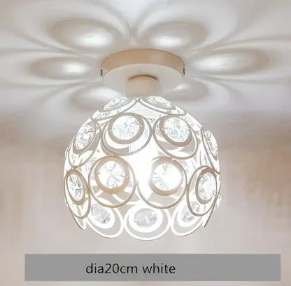 Modern black crystal flush mount ceiling light with white spherical design featuring concentric circles and crystal accents