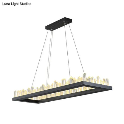 Black rectangular led ceiling light with clear crystal icicle rods emitting warm glow by DecorBites
