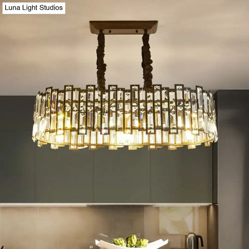 Modern black crystal island pendant light with brass frame and clear rectangular prisms for dining room illumination