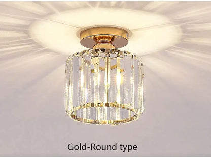 Modern black crystal led ceiling light fixture with gold-toned cylindrical design and vertical crystal prisms decorbites crystal led