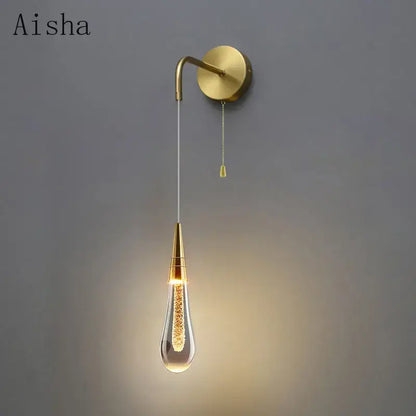 Modern black crystal led wall lamp with gold-toned teardrop glass bulb and brass-finished curved arm for decorbites crystal led wall decor
