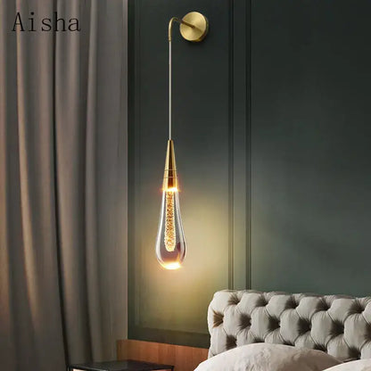 Modern black crystal led wall lamp with gold-finished teardrop sconce and decorbites crystal led filaments for bedroom decor