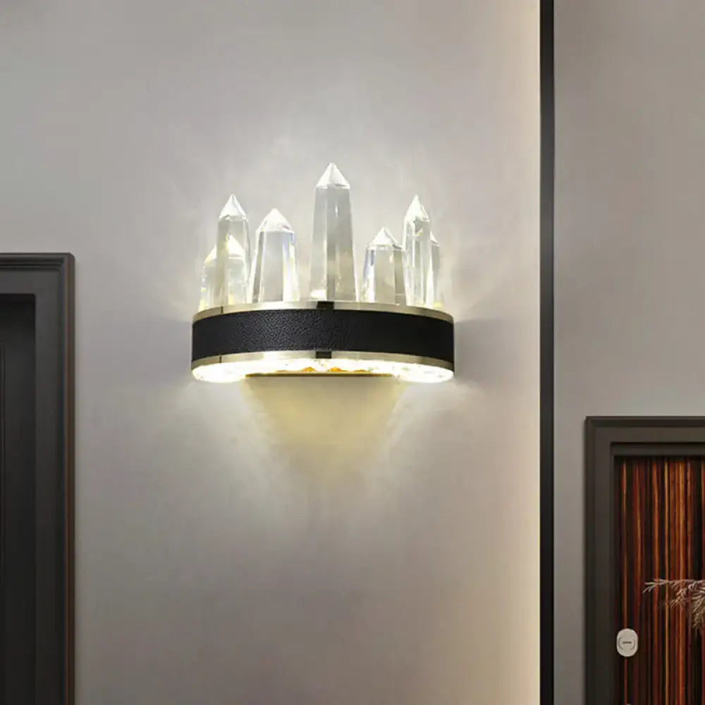 Modern black crystal led wall sconce with icicle shaped wall mount and clear faceted pillars on circular base