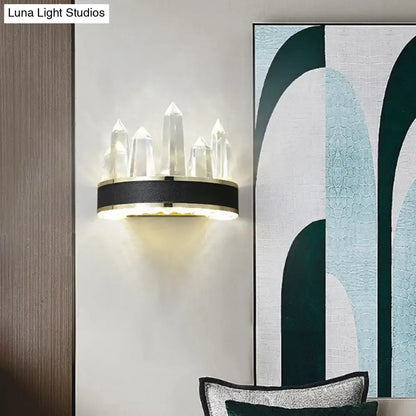 Modern black crystal led wall sconce with crystal-tipped icicle shaped wall mount and sleek metallic circular base