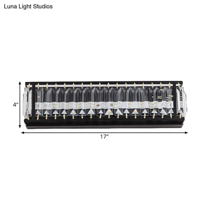Modern black crystal rectangular sconce with clear faceted covers and gold-colored mounting hardware for bedroom wall lighting