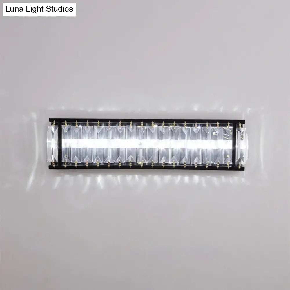 Modern black crystal rectangular sconce with sleek frame and clear crystal prisms for bedroom wall lighting