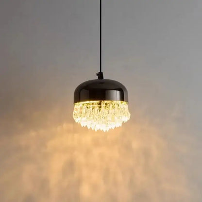 A sleek black crystal tassel chandelier pendant light with clear crystal droplets for modern bedroom decor