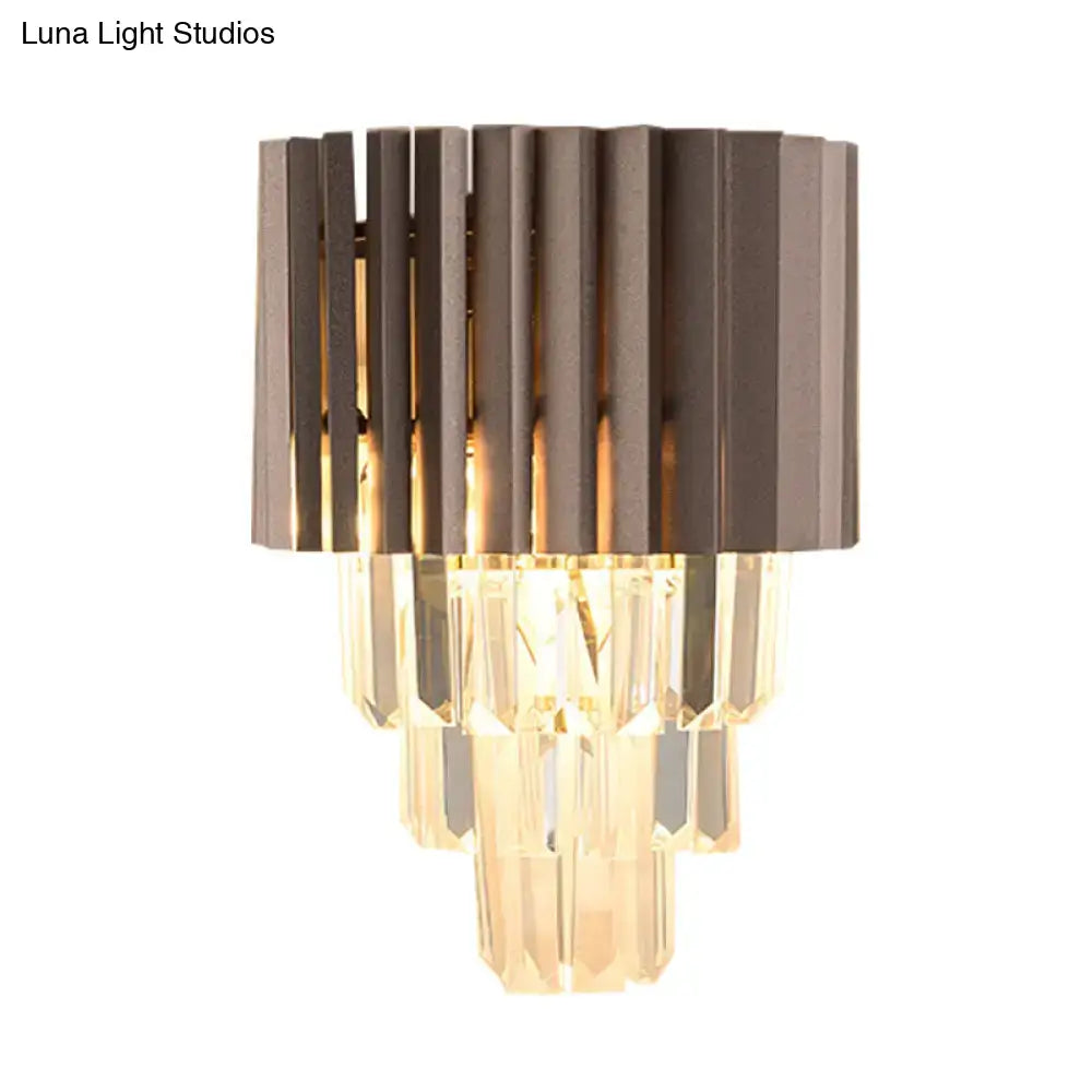 Modern black crystal wall light featuring a sleek dark bronze frame with vertical slats and cascading crystal prisms