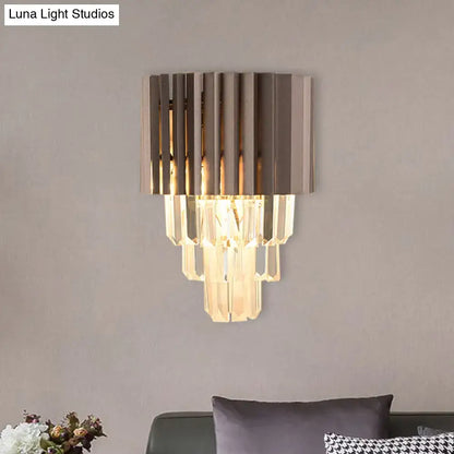 Modern black crystal wall light with vertical metallic slats and cascading clear crystal prisms for bedroom use