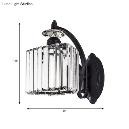 Modern black wrought iron wall light with clear crystal prisms and curved arm for living room in modern style