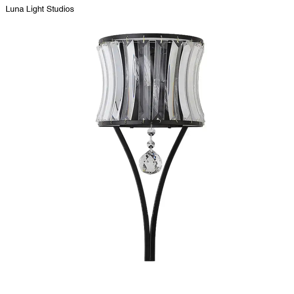 Modern black crystal wall sconce with cylindrical crystal shade and faceted pendant wall mounted lighting fixture