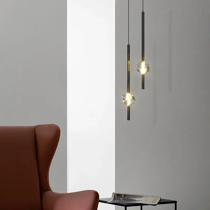 Two sleek black cube crystal pendant lamps with faceted crystal bulbs for warm living room decorbites cube crystal lighting
