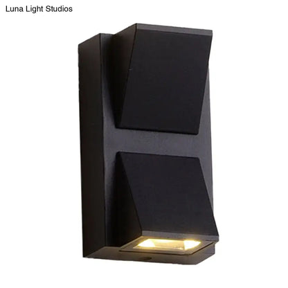 Modern black cube led wall sconce with two angled light panels and warm glow suitable for 110v-120v or 220v-240v use