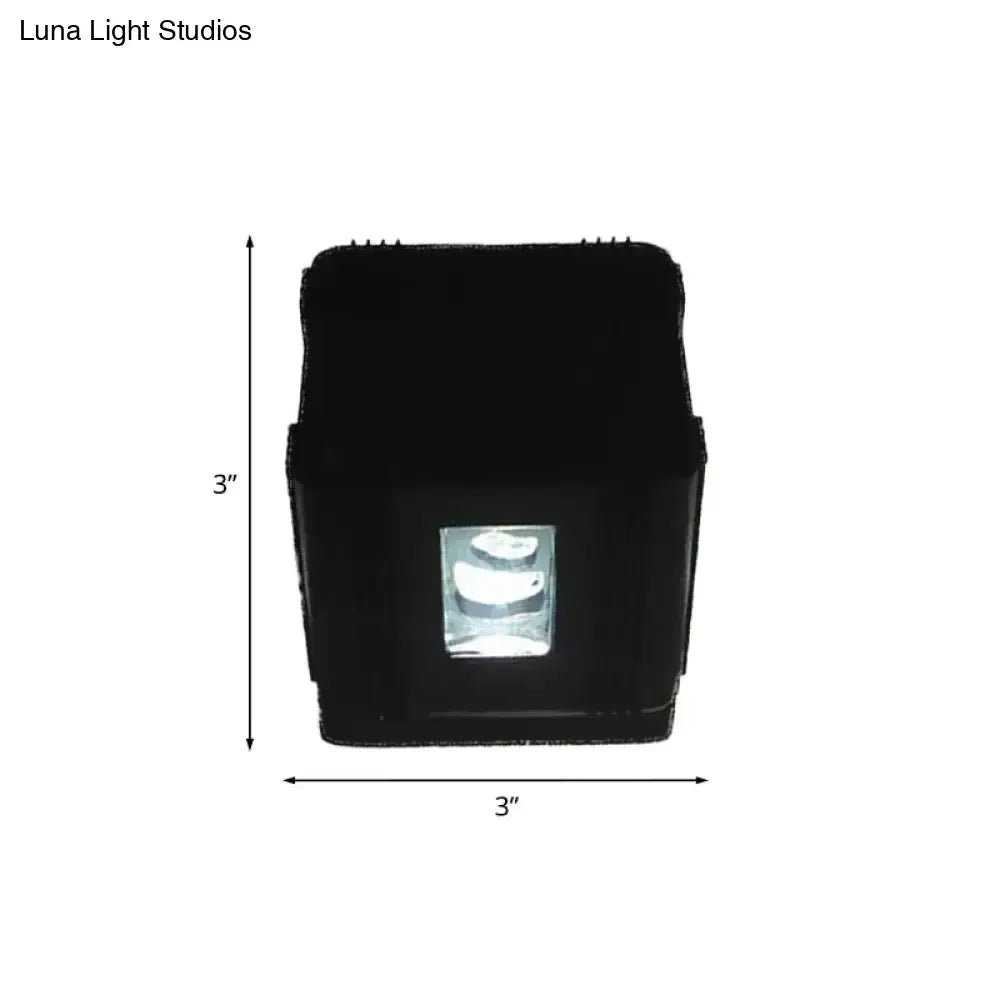 Modern black cubic led wall lamp with a 3x3 inch clear window revealing the internal bulb for bedroom use