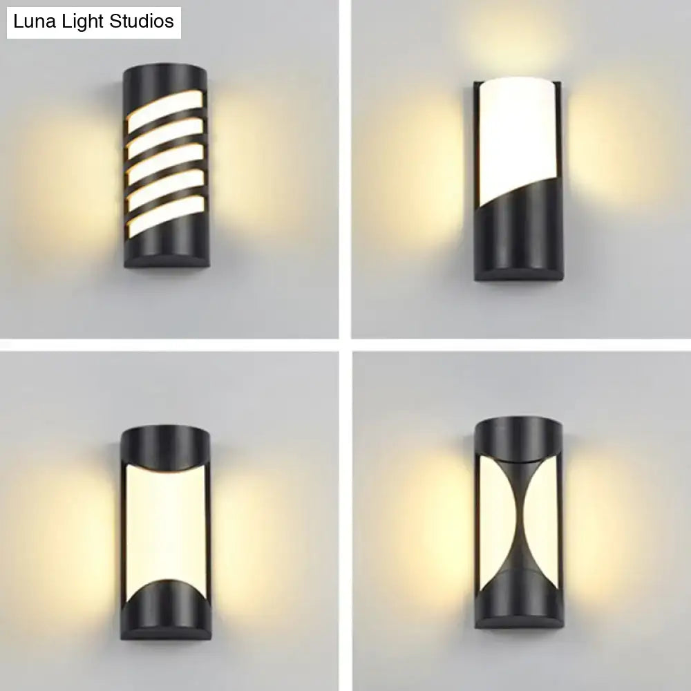 Modern black curved outdoor wall sconce with cylindrical design and geometric LED light patterns for patio lighting