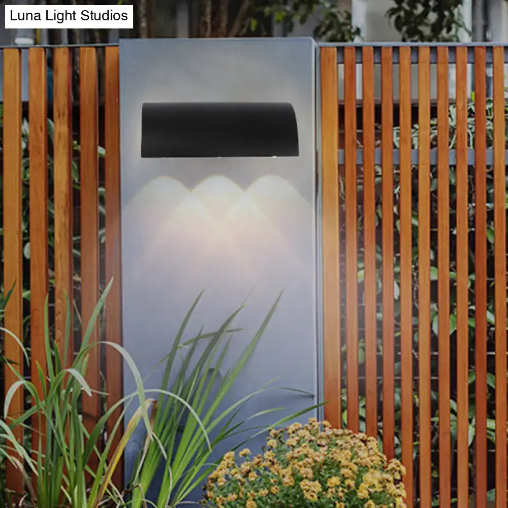 Modern black curved wall lamp outdoor minimalist led light fixture with sleek design emitting warm white light
