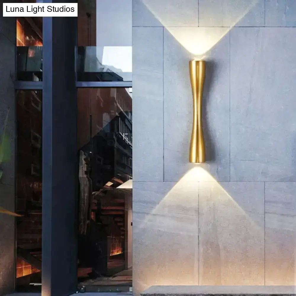 Gold-toned sleek curved wall sconce with modern design suitable as a black outdoor waterproof porch light