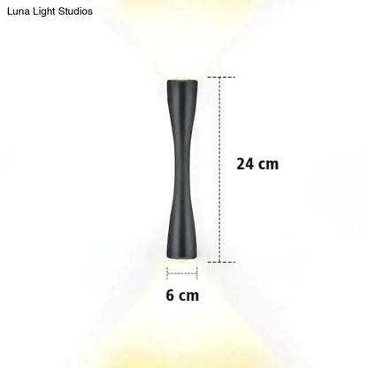 Modern black curved wall sconce outdoor waterproof porch light with a sleek black matte finish and elongated design