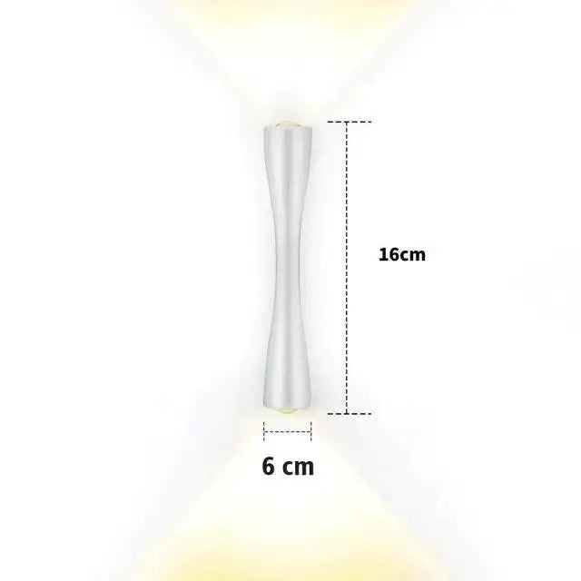 Modern black curved wall sconce outdoor porch light in sleek silver with slender hourglass design and warm led lighting