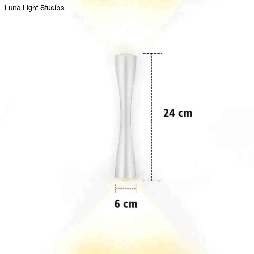Modern black curved wall sconce outdoor porch light with sleek 24 cm tall silver metallic hourglass design and warm yellow light