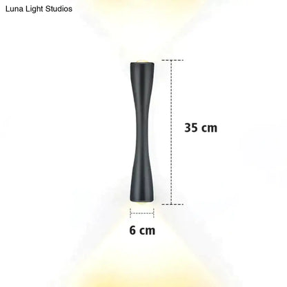 Modern black curved wall sconce with sleek design for outdoor waterproof porch lighting