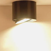 Modern black cylindrical dimmable ceiling spot light with warm focused beam ideal for kitchen downlight use